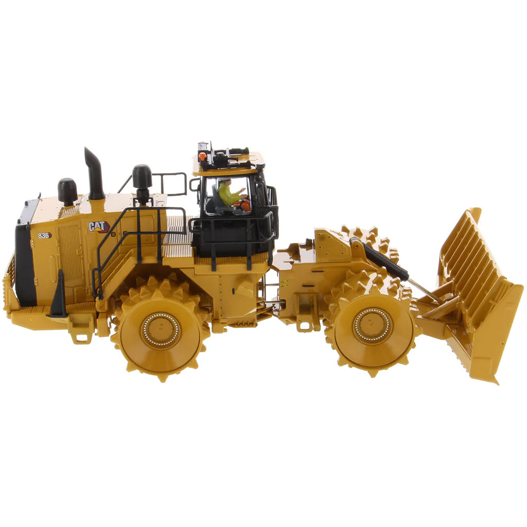 Model of a Caterpillar 836 Landfill Compactor on a White Background