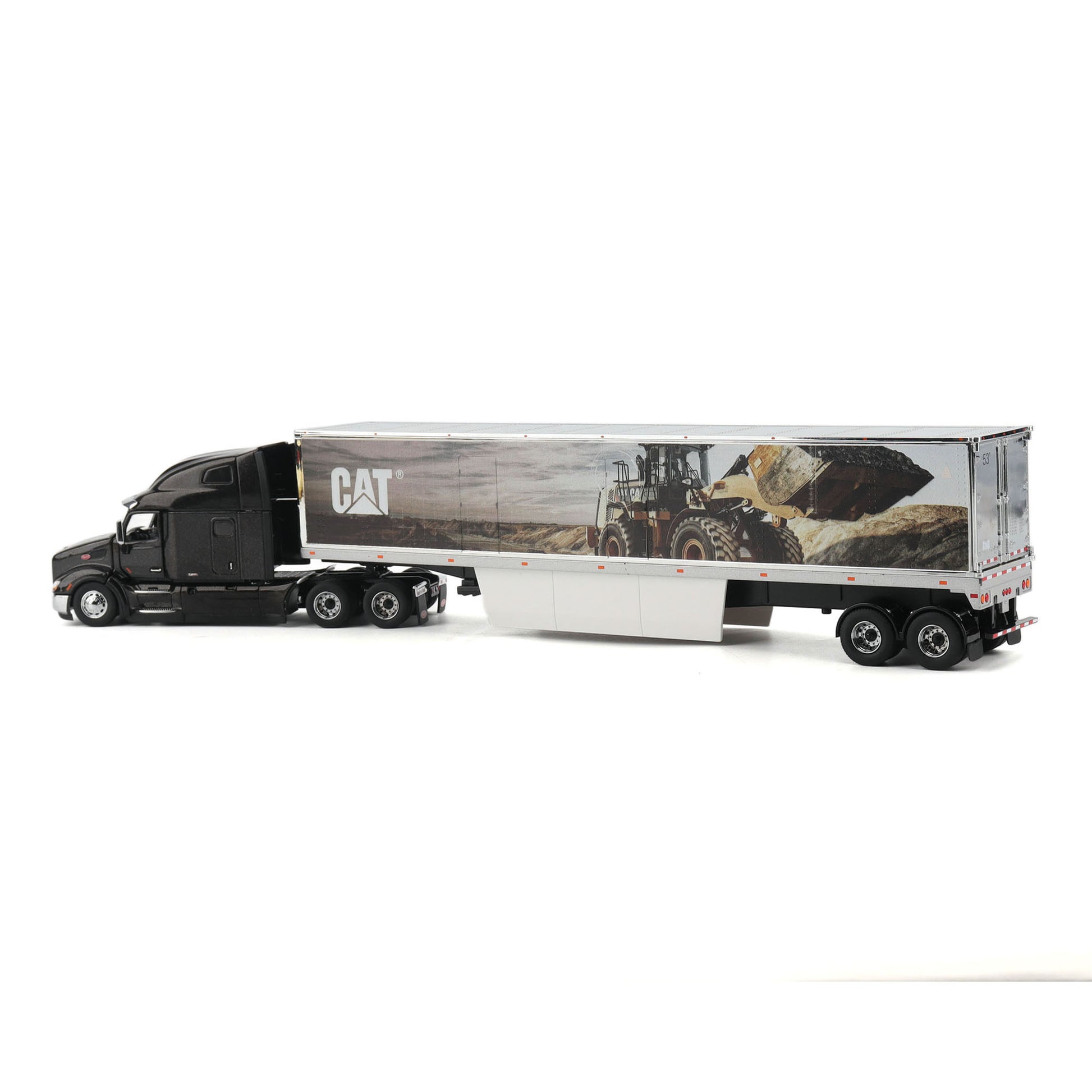 A die-cast model of a semi-truck with a black cab and a white trailer featuring a CAT construction graphic, shown on a plain white background.