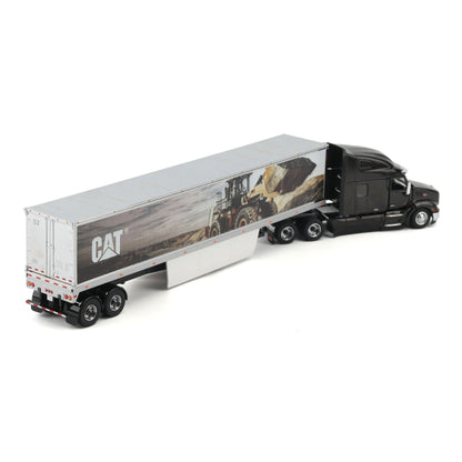 A die-cast model of a semi-truck with a black cab and a silver semi-trailer featuring a CAT logo and a construction scene graphic, shown on a white background.