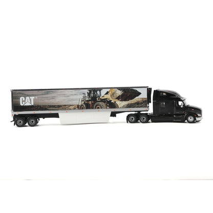 A diecast model of a semi-truck with a black cab and a white trailer featuring a CAT construction graphic, shown against a plain white background.