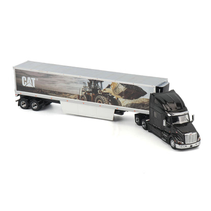 A diecast model of a semi-truck with a black cab and a silver trailer printed with a CAT construction graphic, shown on a white background.