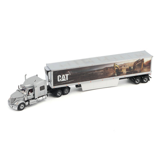 A silver die-cast model of a semi-truck with a trailer featuring a CAT construction graphic, shown on a plain white background.