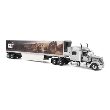 A die-cast model of a silver semi-truck with a long white box trailer featuring a large CAT construction graphic, shown on a white background.