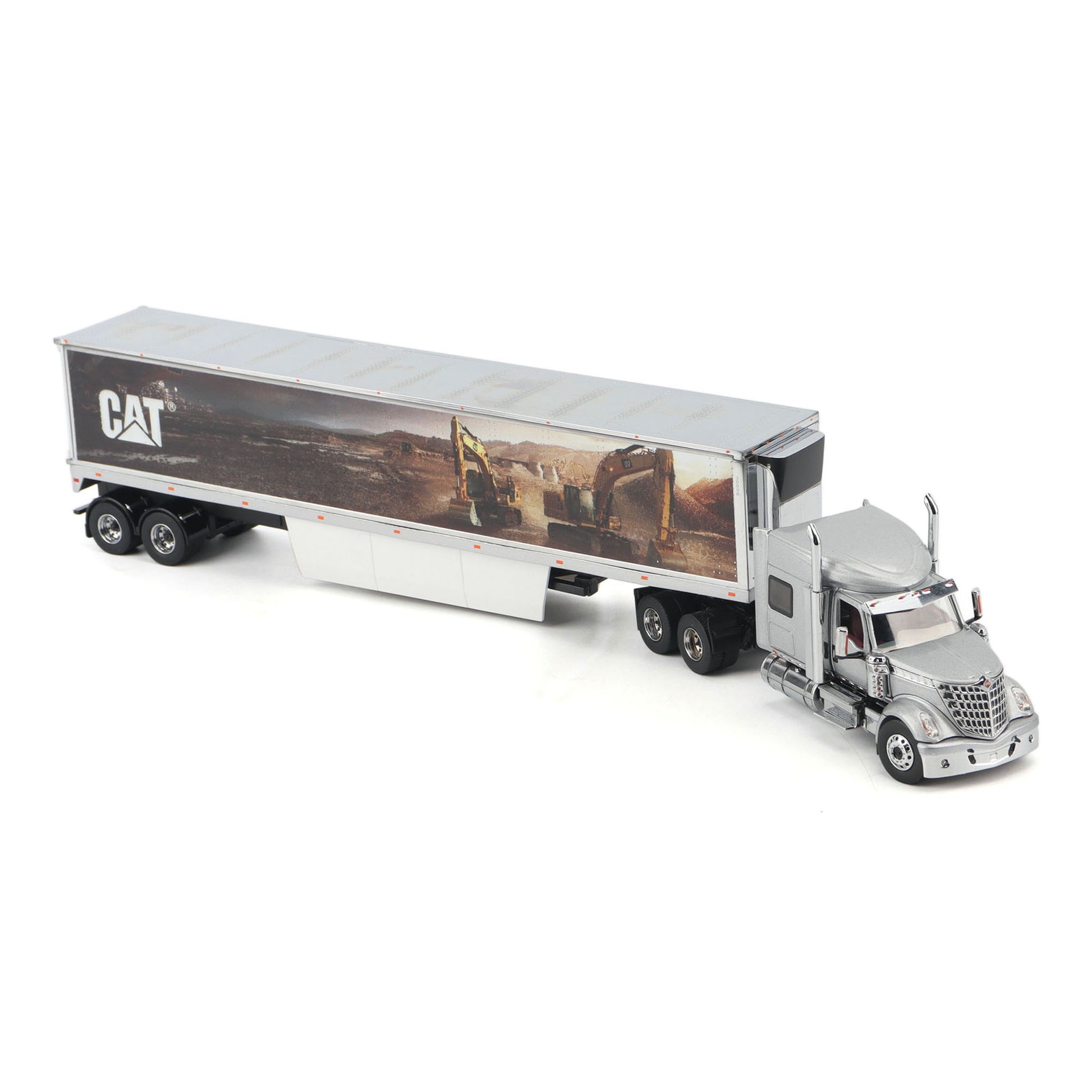 A silver toy model of a semi-truck with a trailer featuring a CAT construction graphic, shown on a plain white background.