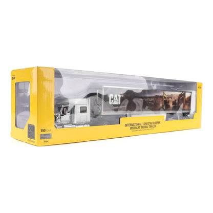 A toy model of an International Lonestar sleeper trailer with a CAT animal trailer, shown inside its yellow retail packaging on a white background.