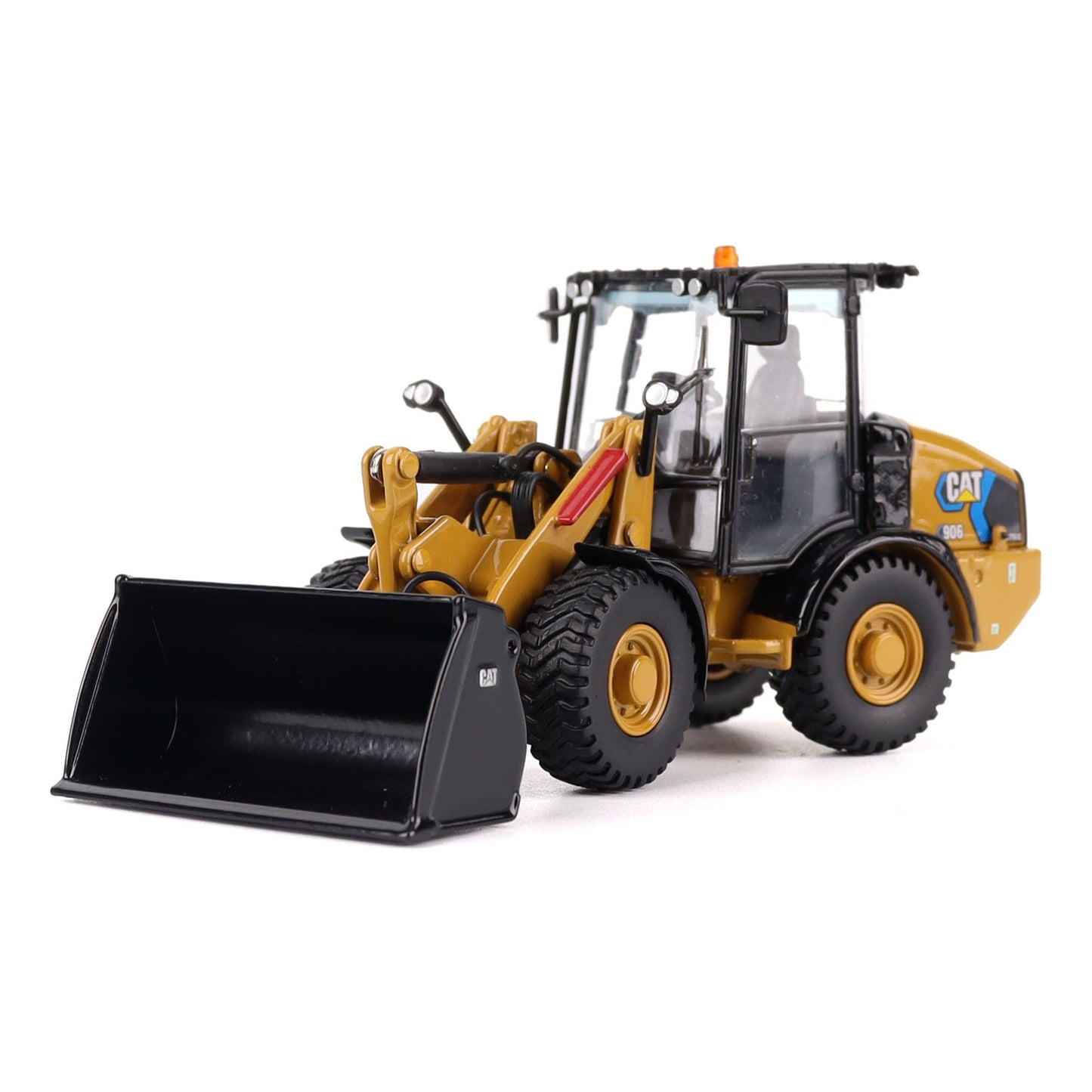 1:50th scale model of a Caterpillar 906M Electric Compact Wheel Loader photographed on a white background