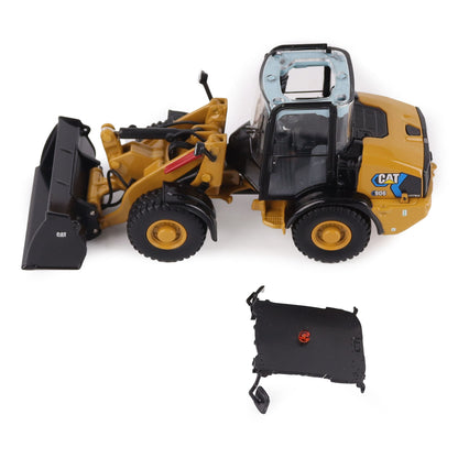 1:50th scale model of a Caterpillar 906M Electric Compact Wheel Loader photographed on a white background