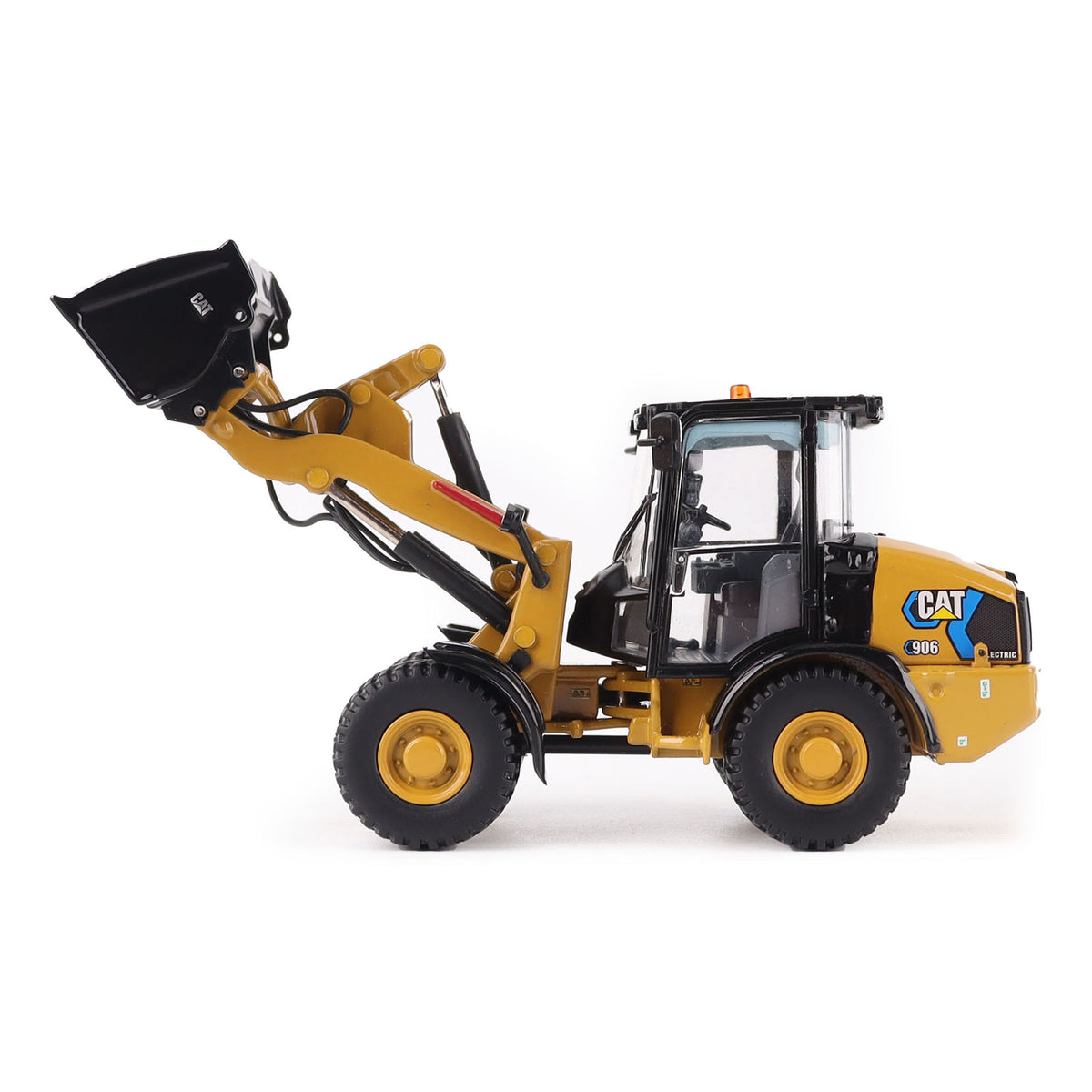 1:50th scale model of a Caterpillar 906M Electric Compact Wheel Loader photographed on a white background