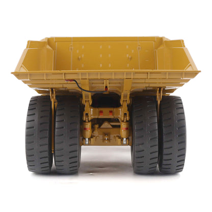 1:50 Scale Diecast Model of a Cat Yellow Caterpillar 789 Mining Truck on a White Background