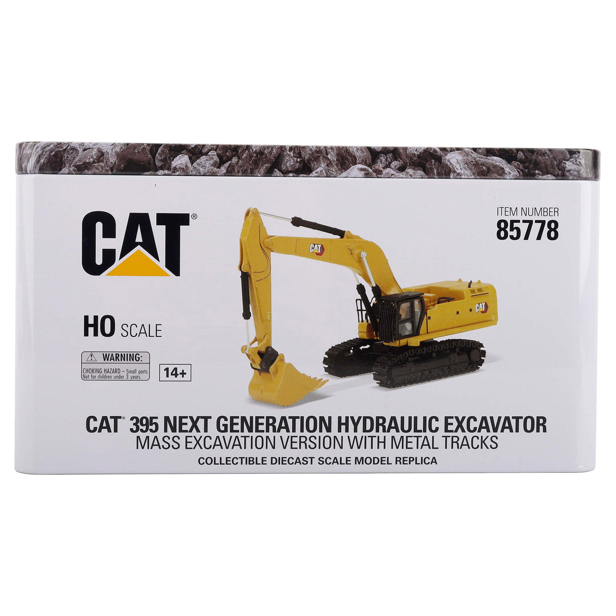 CAT 395 Next Generation Hydraulic Excavator HO scale collectible diecast model replica in its original white metal tin packaging, featuring the yellow excavator model on the front.