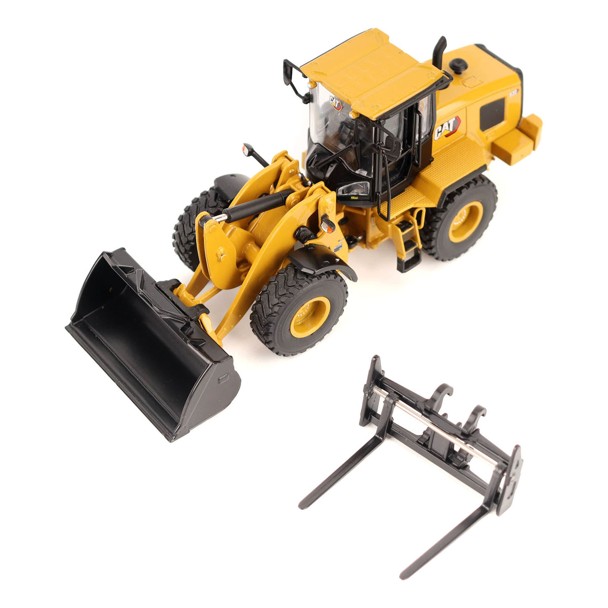1:50th Scale Diecast Model of a CAT Yellow & Black Model of a Caterpillar 930 Wheel Loader Photographed on a White Background