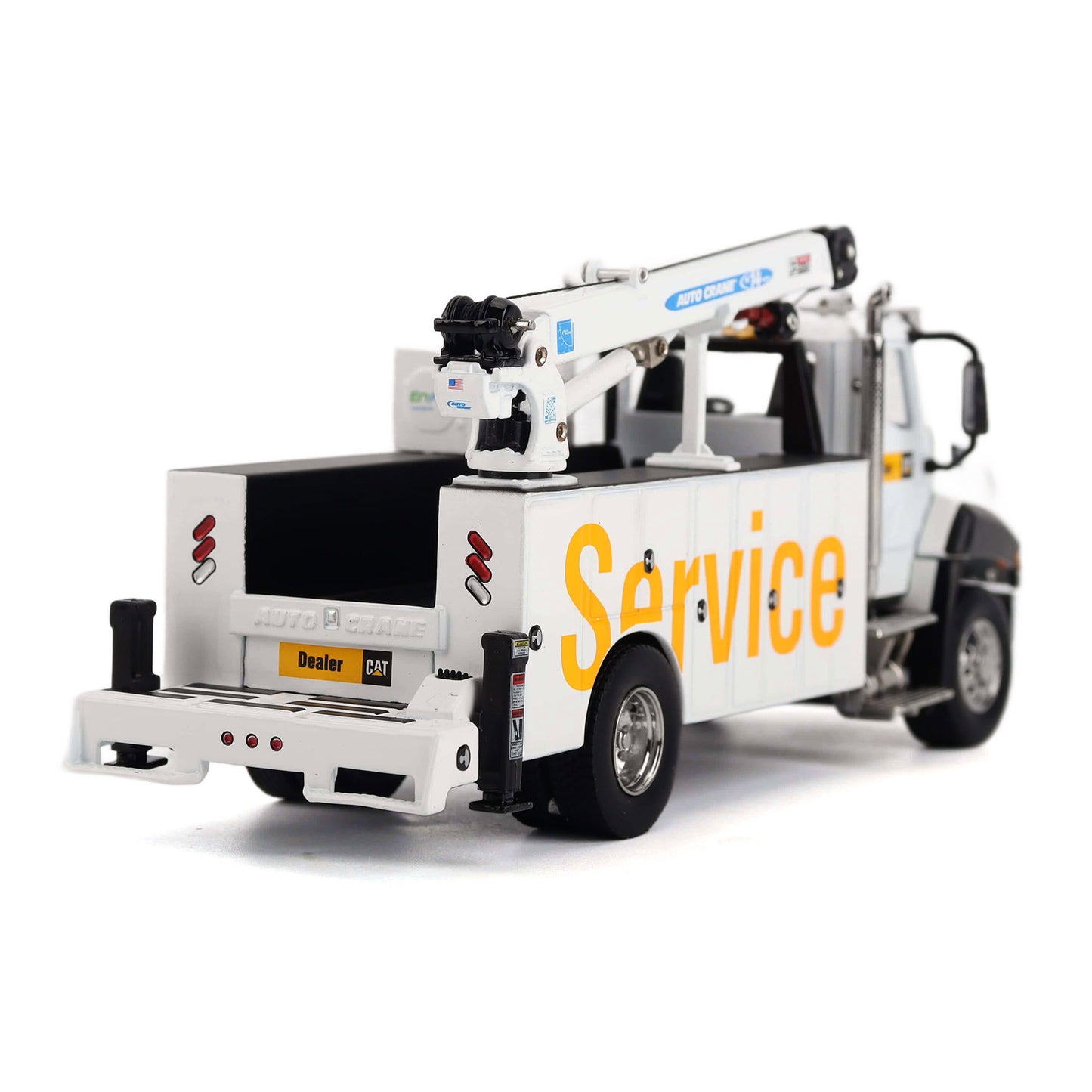 A white die-cast model tow truck with a crane arm, featuring 'Service' printed in yellow on the side and a small 'Dealer' plate on the rear bumper, shown against a plain white background.