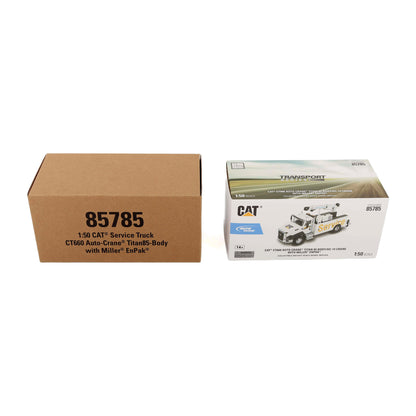 CAT 1:50 scale service truck model kit packaging, showing the brown cardboard outer box with black text and the white inner retail box featuring the CAT Transport logo and vehicle illustration.