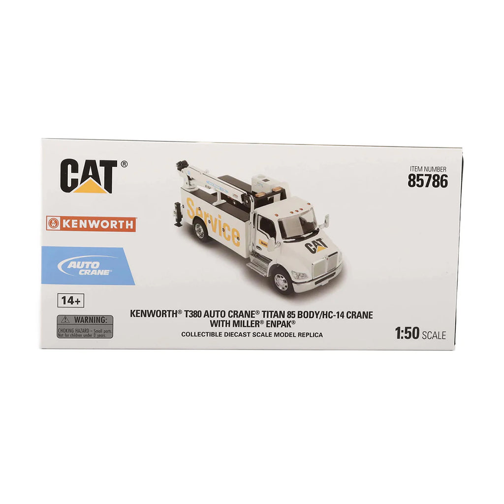 Boxed model of a Kenworth truck with crane, featuring Caterpillar logo.