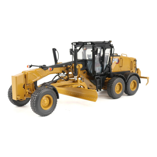 Model of a Caterpillar 140 LVR Motor Grader on a White Background