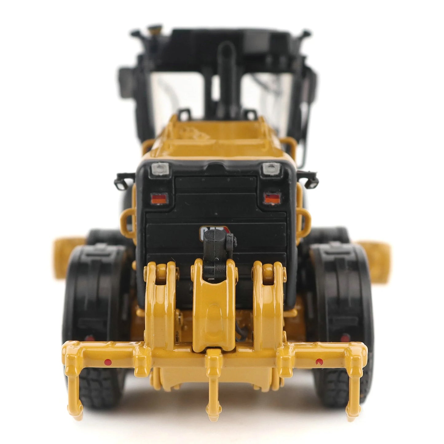 Model of a Caterpillar 140 LVR Motor Grader on a White Background