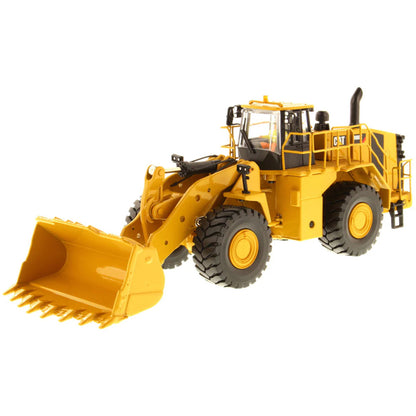 Model of a Yellow Caterpillar 988K Wheel Loader on a White Background