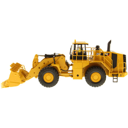 Model of a Yellow Caterpillar 988K Wheel Loader on a White Background