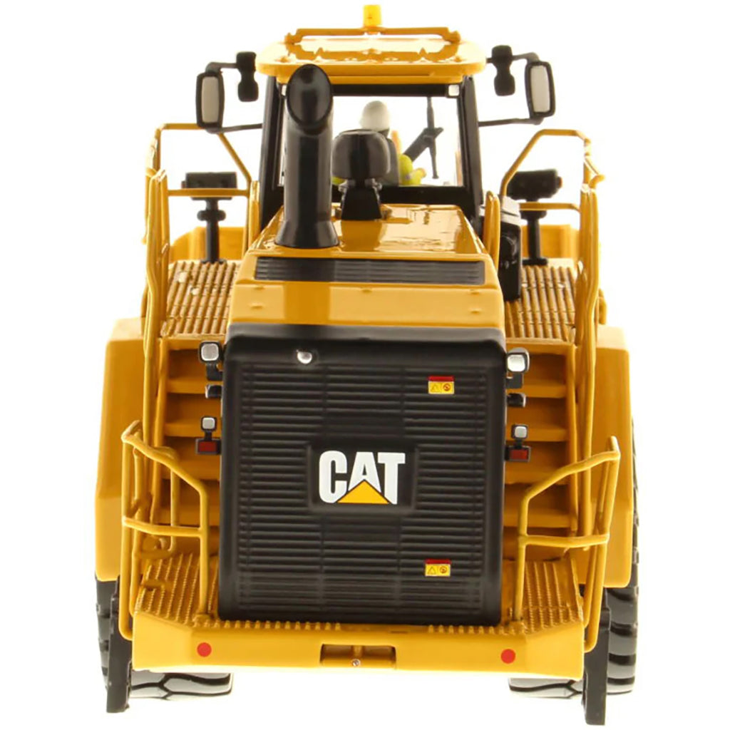 Model of a Yellow Caterpillar 988K Wheel Loader on a White Background