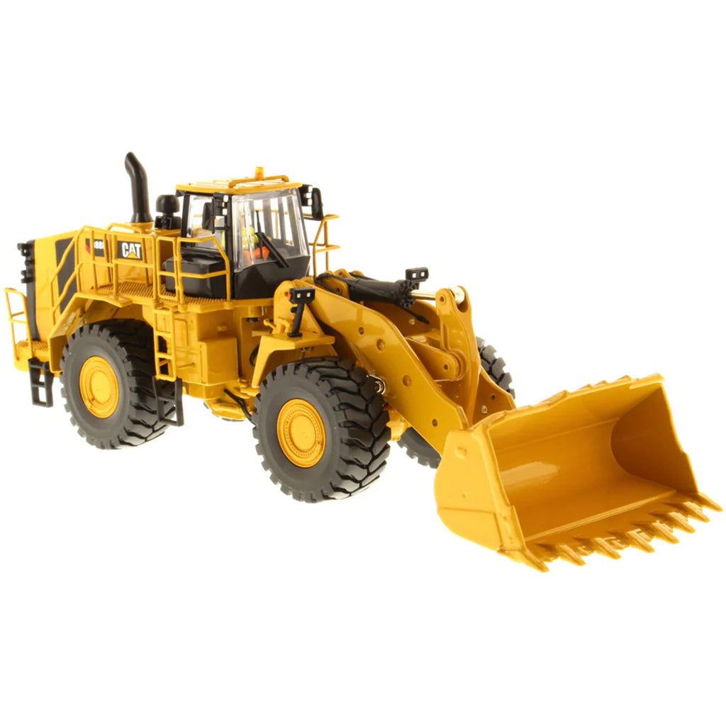 Model of a Yellow Caterpillar 988K Wheel Loader on a White Background