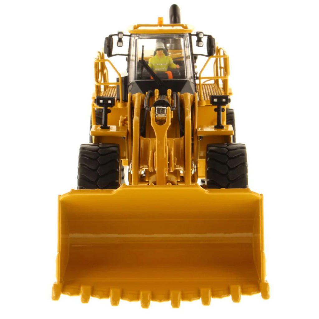 Model of a Yellow Caterpillar 988K Wheel Loader on a White Background