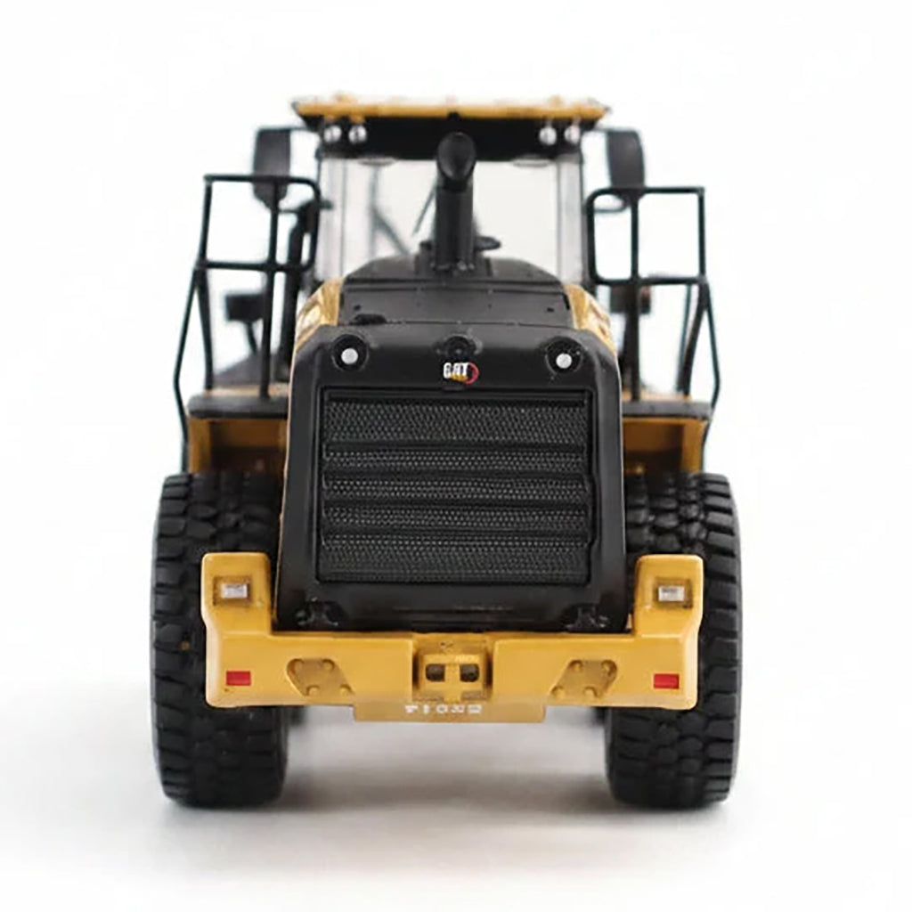 1:50th Scale Model of a CAT Yellow and Black Caterpillar 950M Wheel Loader Photographed on a Clean White Background