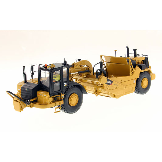 Model of a Caterpillar 627K Wheel Tractor Scraper on a White Background