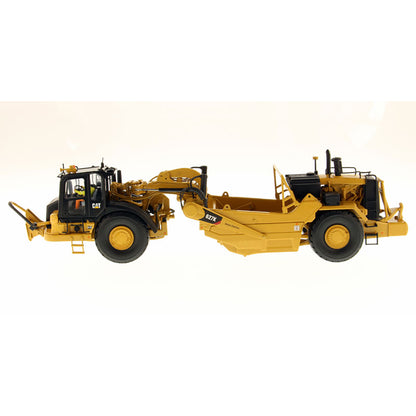 Model of a Caterpillar 627K Wheel Tractor Scraper on a White Background