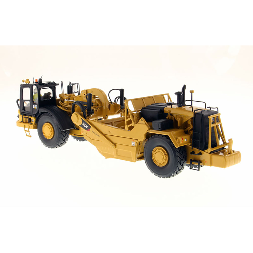 Model of a Caterpillar 627K Wheel Tractor Scraper on a White Background