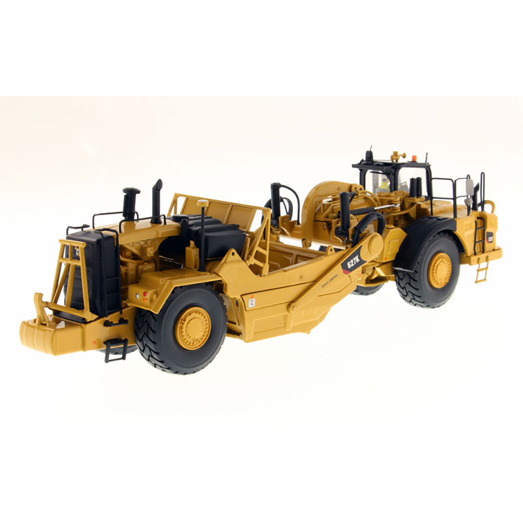 Model of a Caterpillar 627K Wheel Tractor Scraper on a White Background