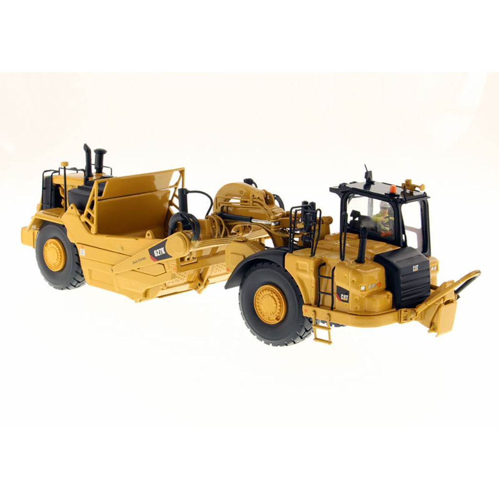Model of a Caterpillar 627K Wheel Tractor Scraper on a White Background