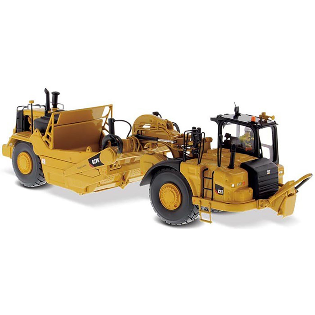Model of a Caterpillar 627K Wheel Tractor Scraper on a White Background