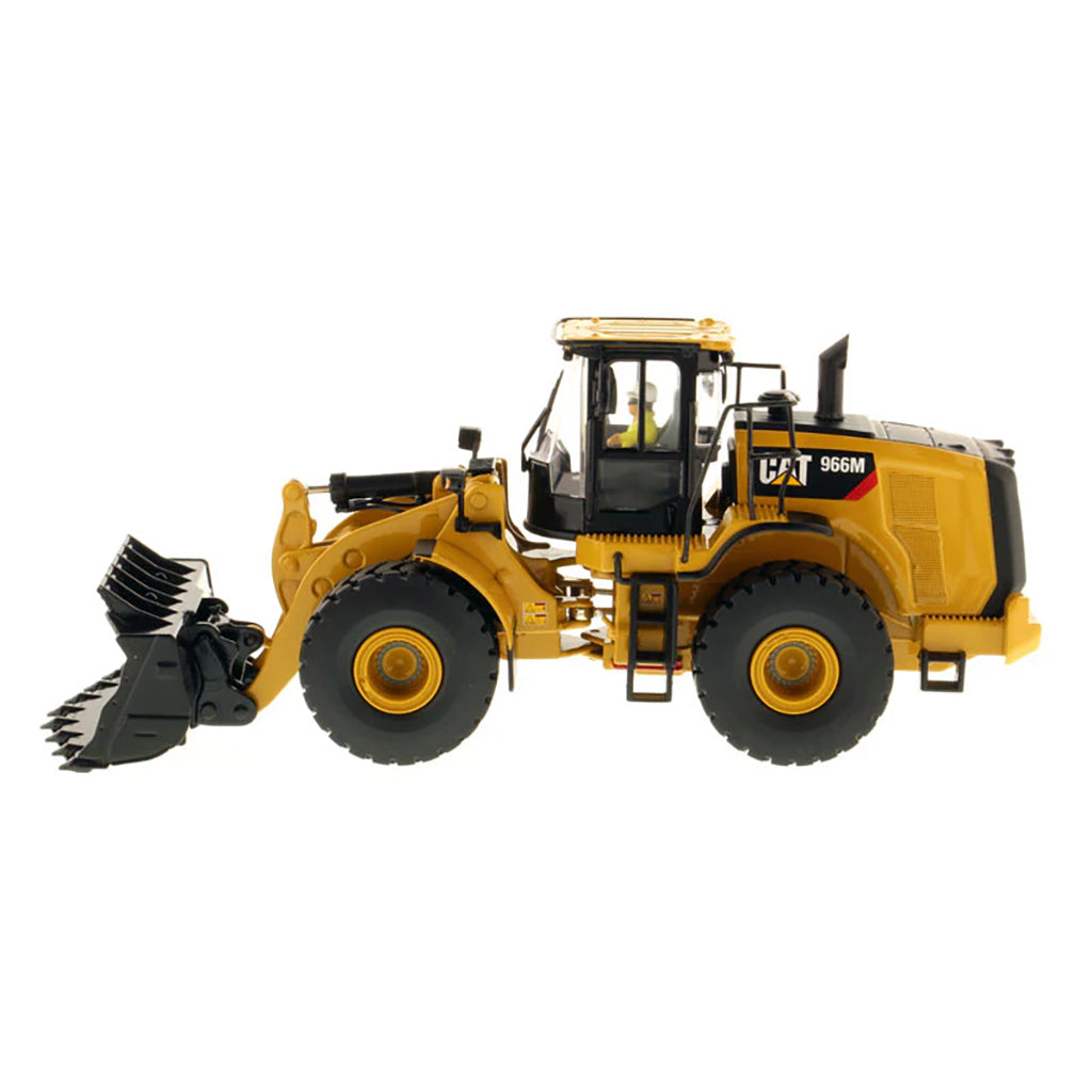 Model of a yellow Caterpillar 966M Wheel Loader on a white background