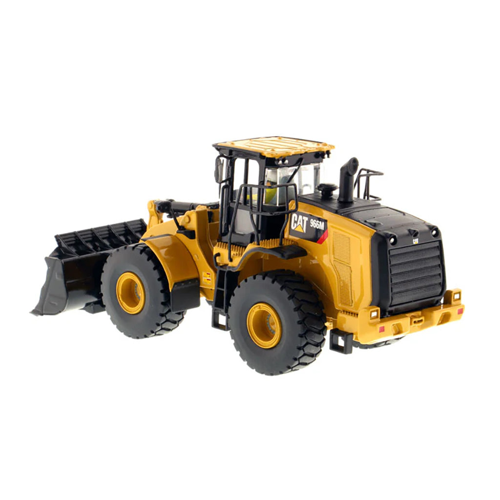 Model of a yellow Caterpillar 966M Wheel Loader on a white background