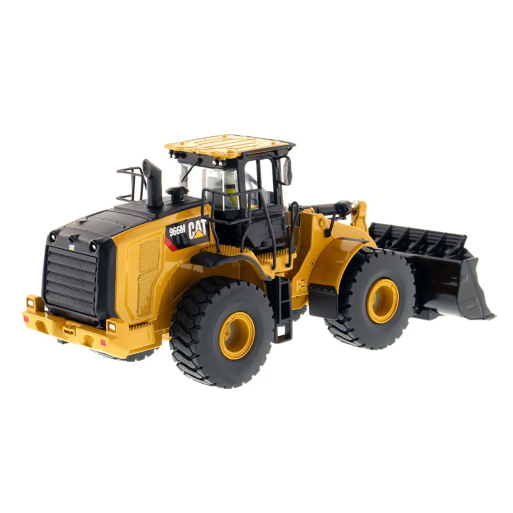 Model of a yellow Caterpillar 966M Wheel Loader on a white background