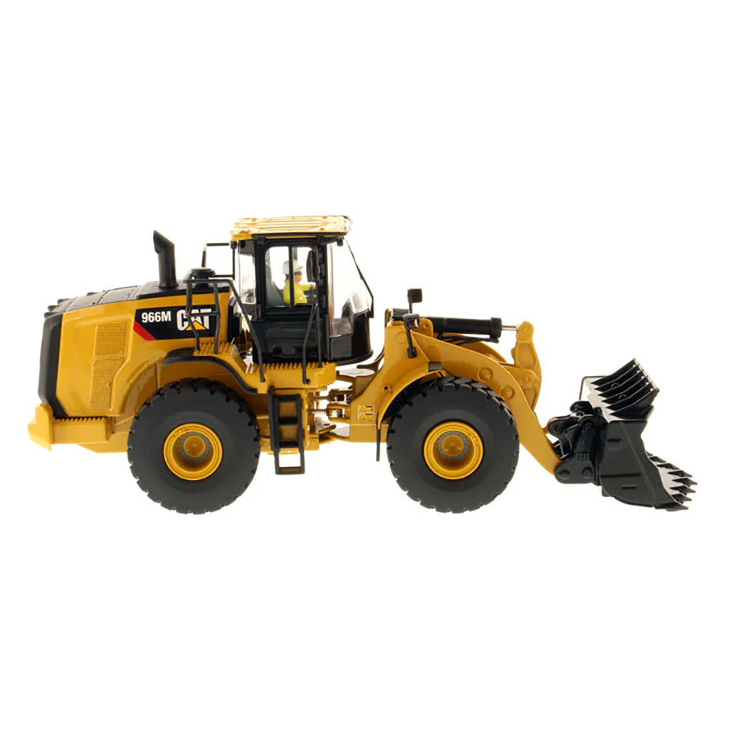 Model of a yellow Caterpillar 966M Wheel Loader on a white background
