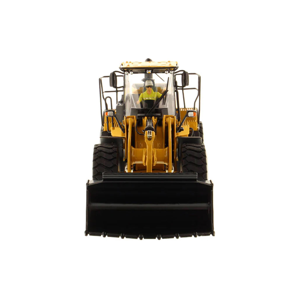 Model of a yellow Caterpillar 966M Wheel Loader on a white background