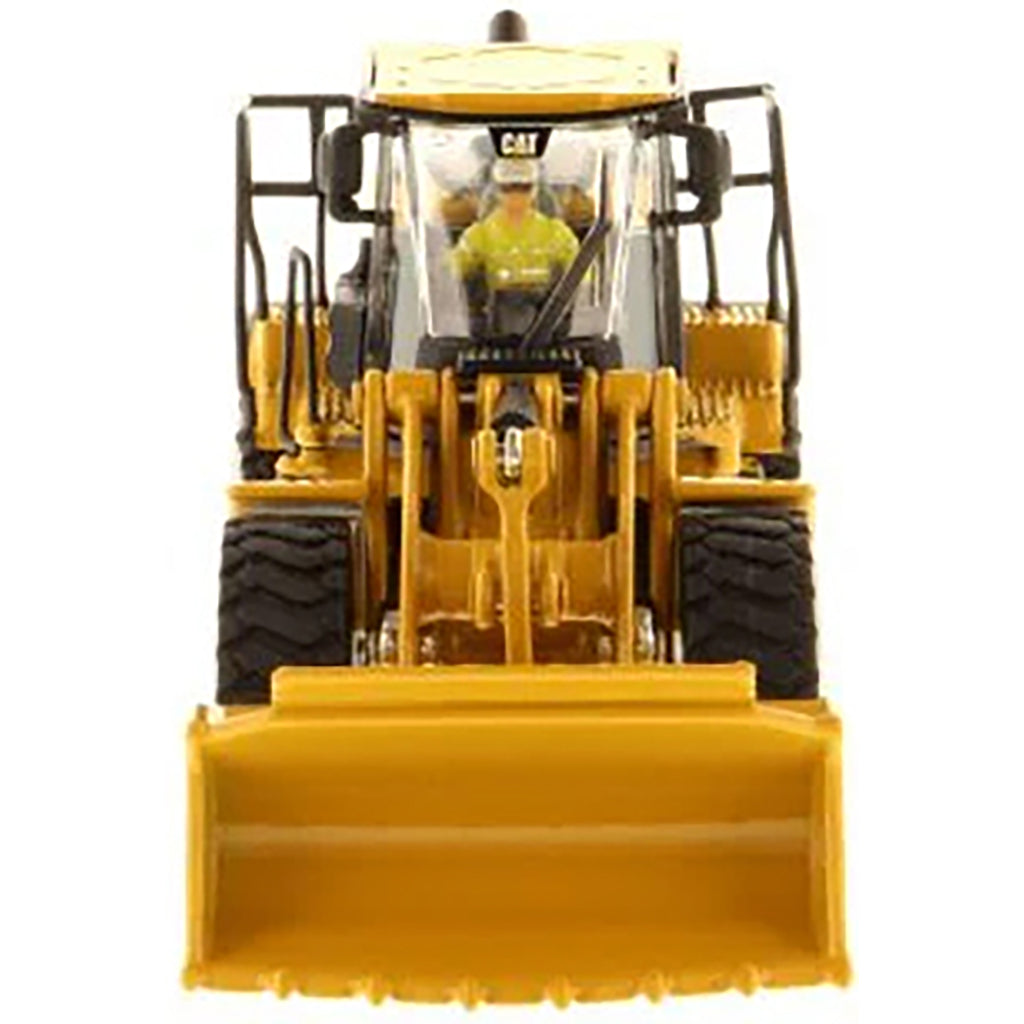 Model of a Caterpillar 966M Wheel Loader on a White Background