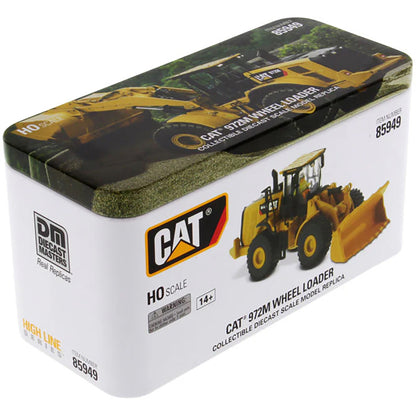 Model of a CAT 972M Wheel Loader in packaging with branding and product details.