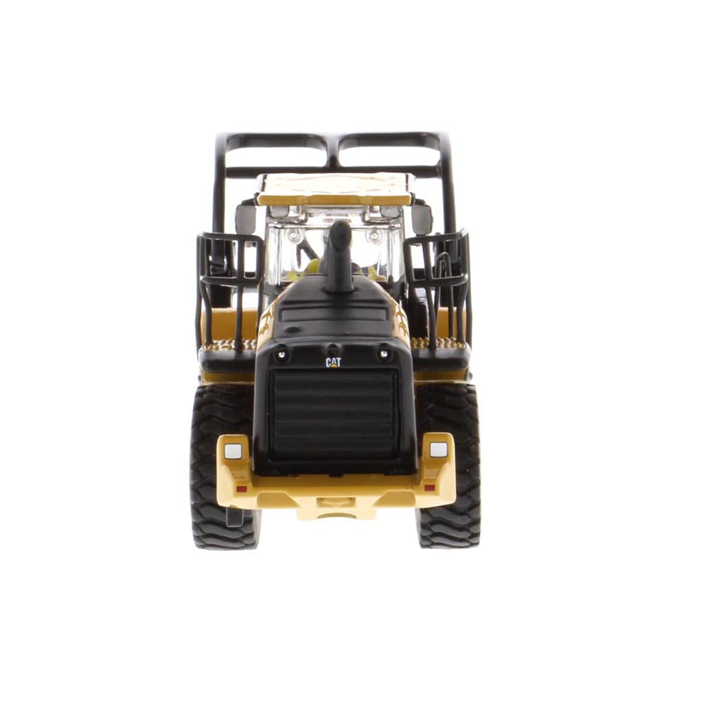 1:50th Scale Diecast Model of a Yellow and Black Caterpillar 972M Wheel Loader with Log Forks on a White Background