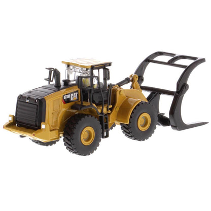 1:50th Scale Diecast Model of a Yellow and Black Caterpillar 972M Wheel Loader with Log Forks on a White Background