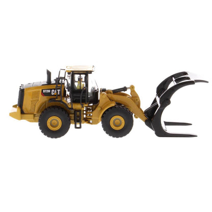 1:50th Scale Diecast Model of a Yellow and Black Caterpillar 972M Wheel Loader with Log Forks on a White Background