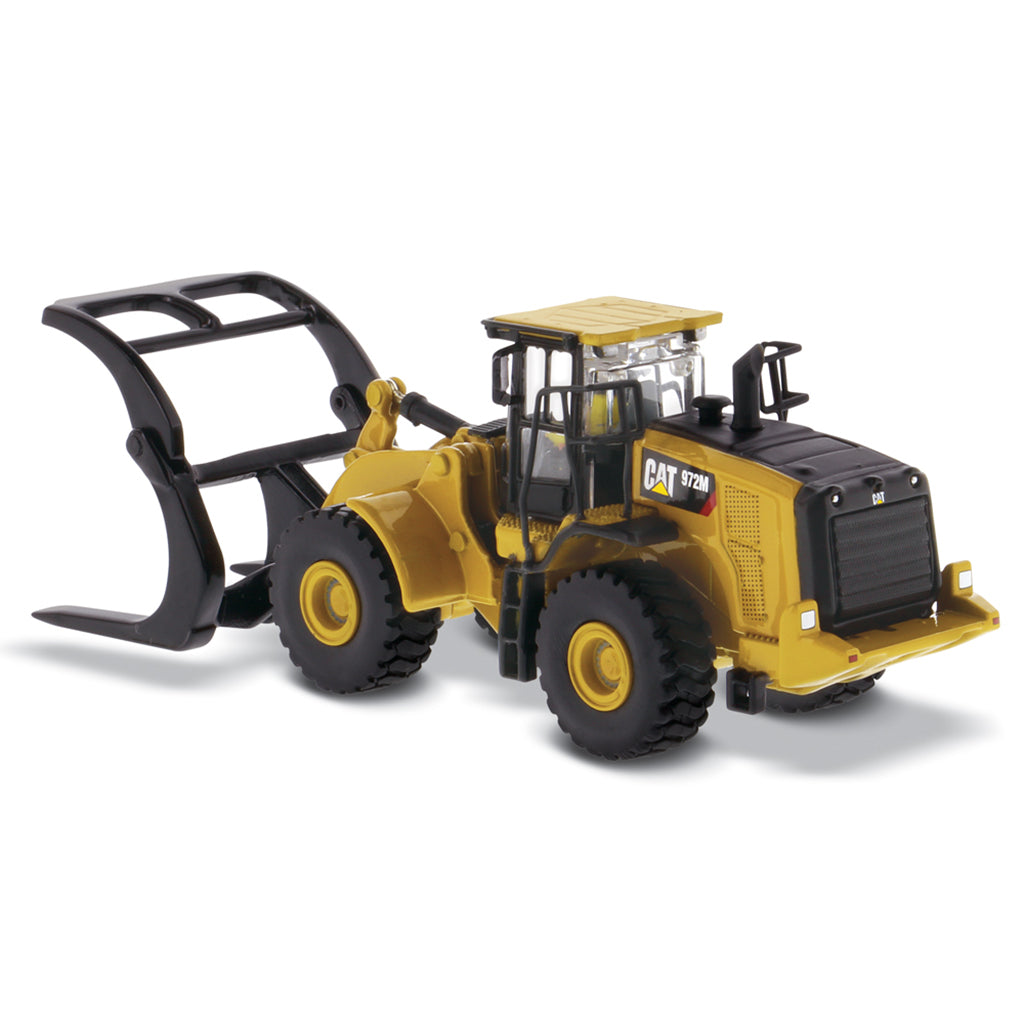 1:50th Scale Diecast Model of a Yellow and Black Caterpillar 972M Wheel Loader with Log Forks on a White Background