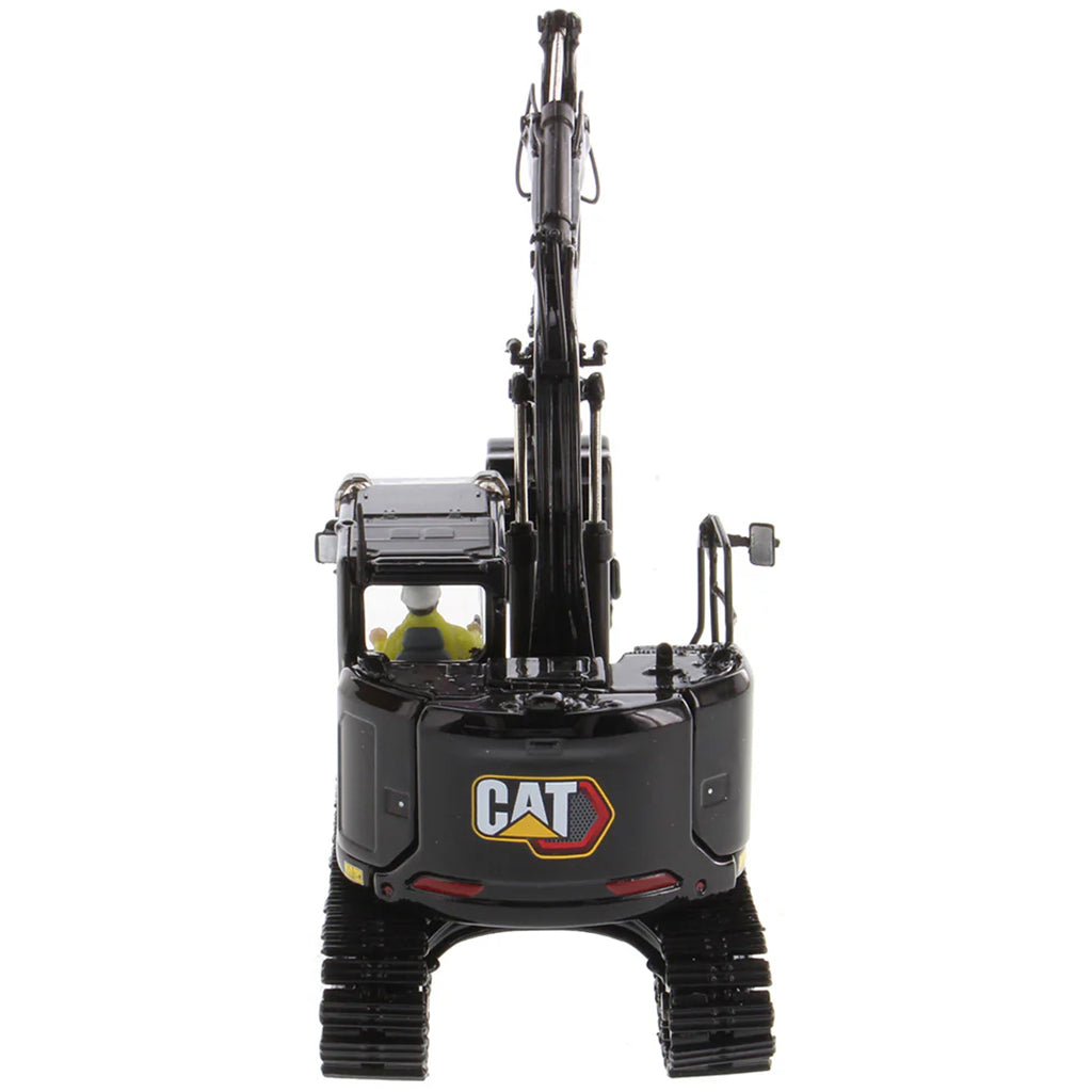 Model of a Caterpillar 315 Mini-Excavator in a Special Black Finish on a White Background