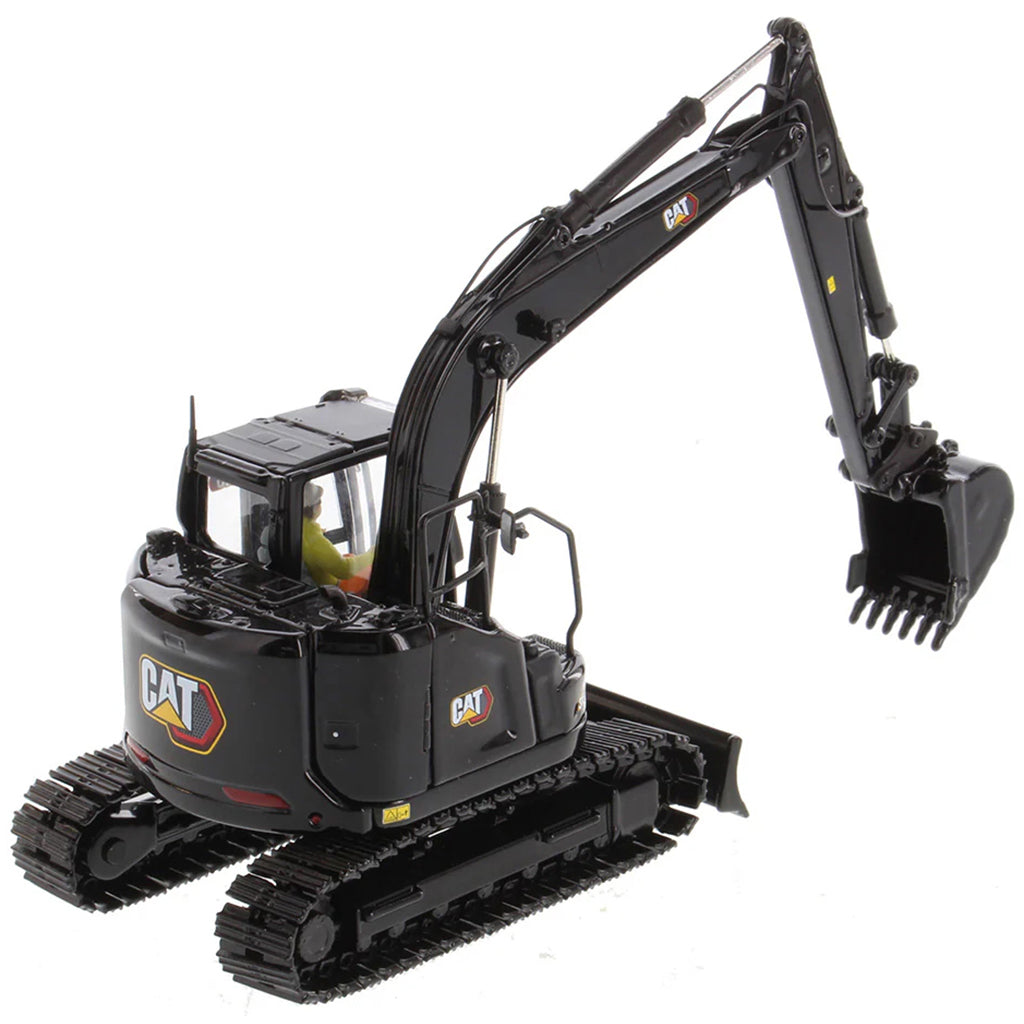 Model of a Caterpillar 315 Mini-Excavator in a Special Black Finish on a White Background
