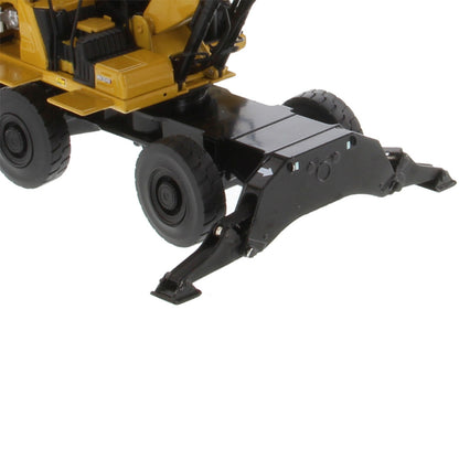 Close-up of a yellow and black construction vehicle attachment, showing the rear wheels and a black metal scoop or grapple arm on a white background.