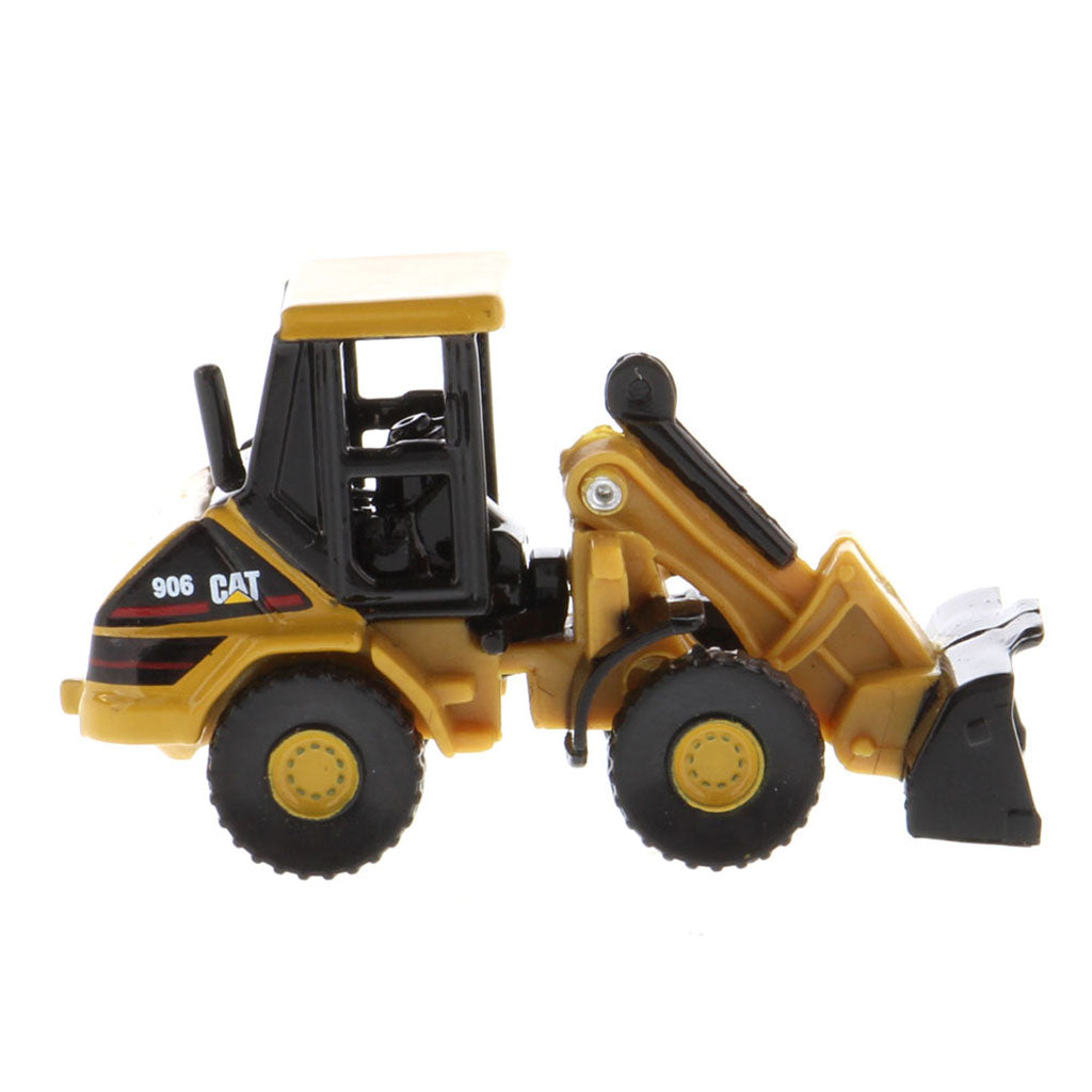 A yellow and black CAT toy loader, model 906, shown in a side profile view against a plain white background.