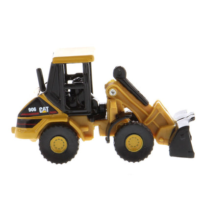 A yellow and black CAT toy loader, model 906, shown in a side profile view against a plain white background.