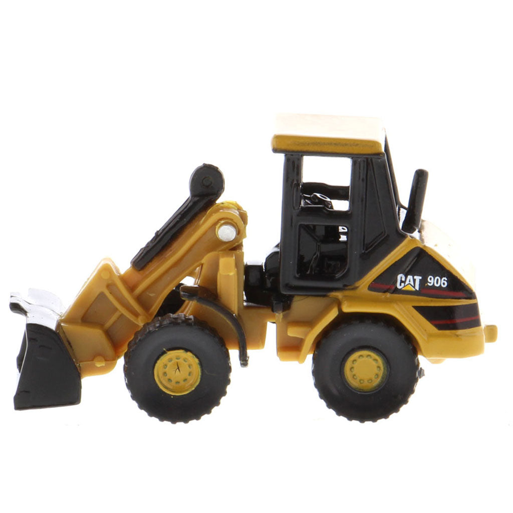 A yellow and black CAT 906 toy loader, shown from a side profile view against a solid white background.