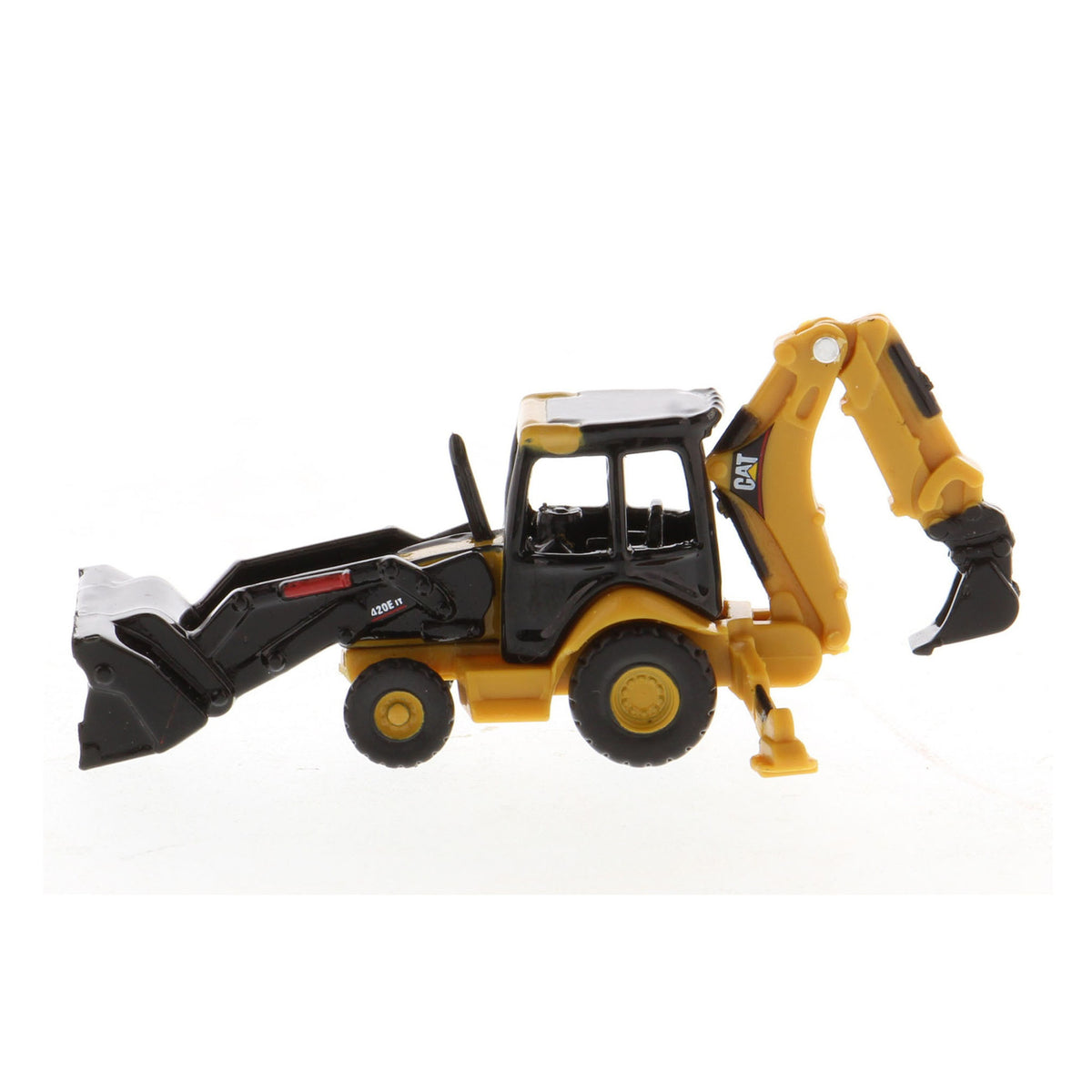 A small yellow and black toy caterpillar backhoe loader with a front loader bucket and rear excavating arm, photographed on a plain white background.
